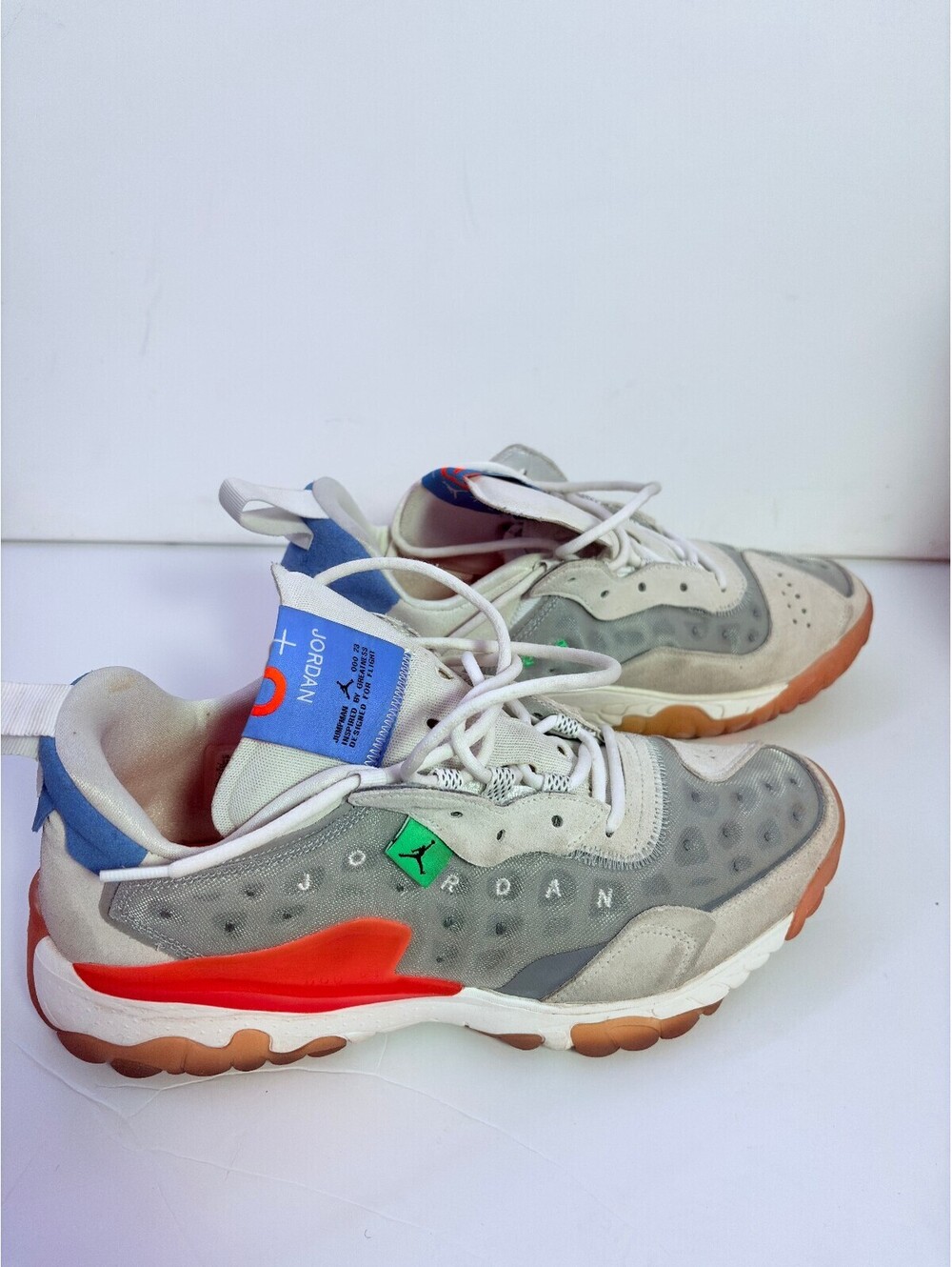Jordan React white gray sneakers with orange outsole